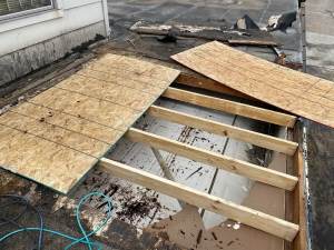 Flat-Roof-Damaged-Plywood