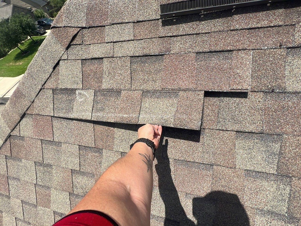 Wind Damage Missing Shingles on House